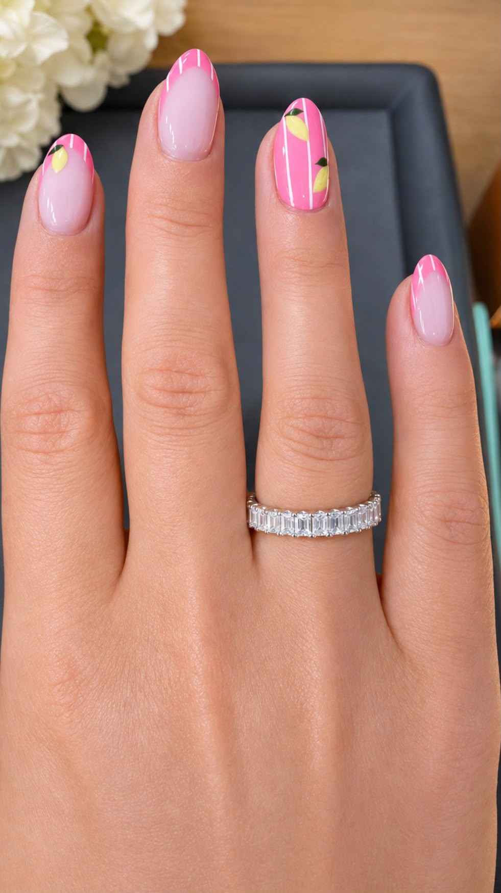 Emerald cut diamond eternity band worn on a hand